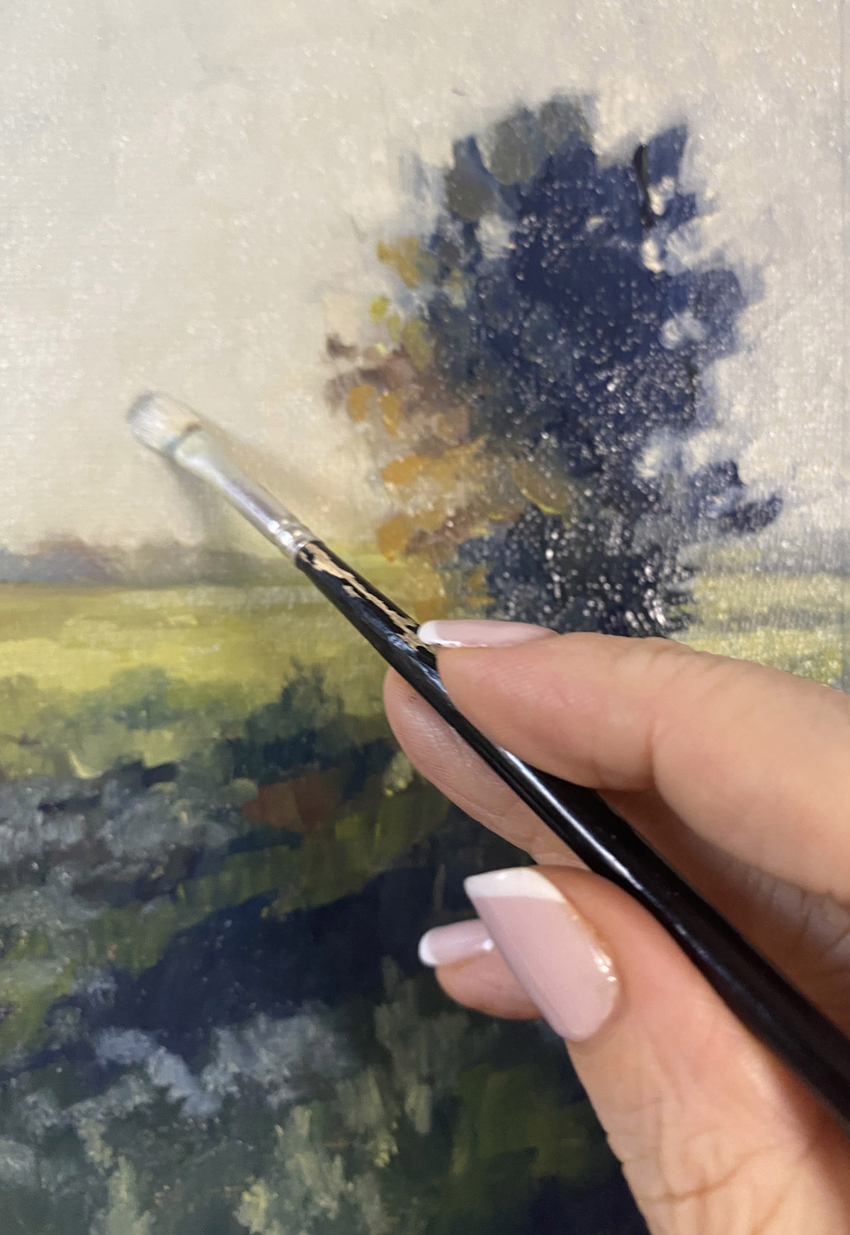 Studio process detail of a painting with tree, light and slow observation