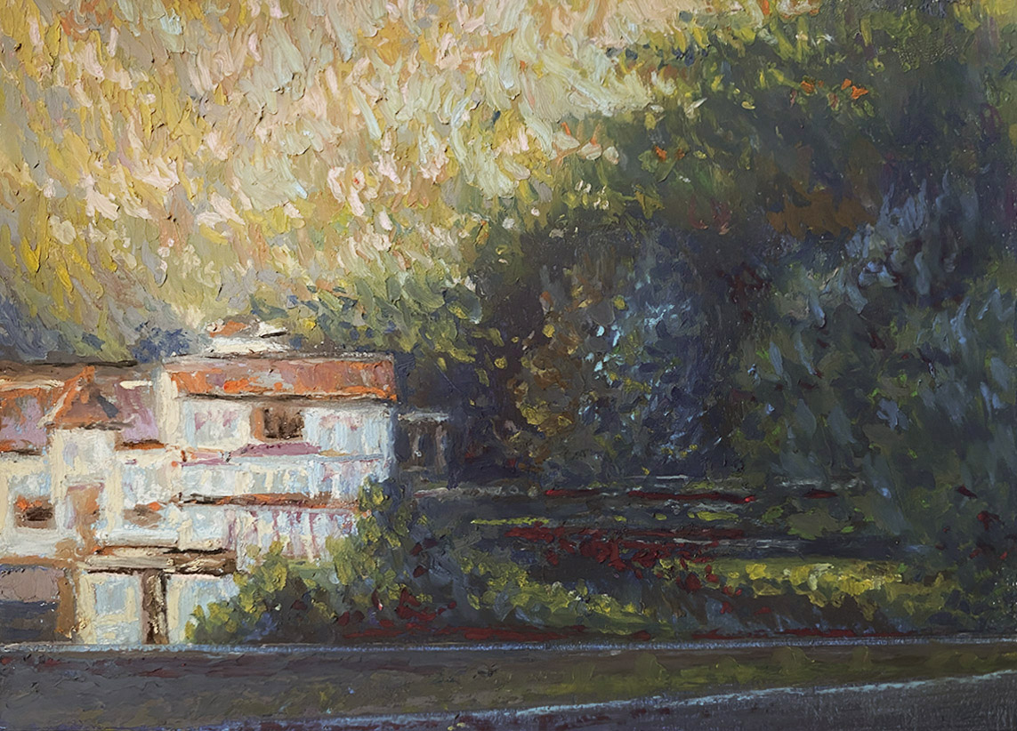 Distant house in the mountains with evening light and shadow